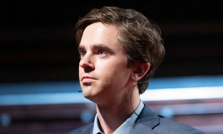freddie highmore as shaun murphy looking into the distance while on a ted talk stage in the good doctor series finale