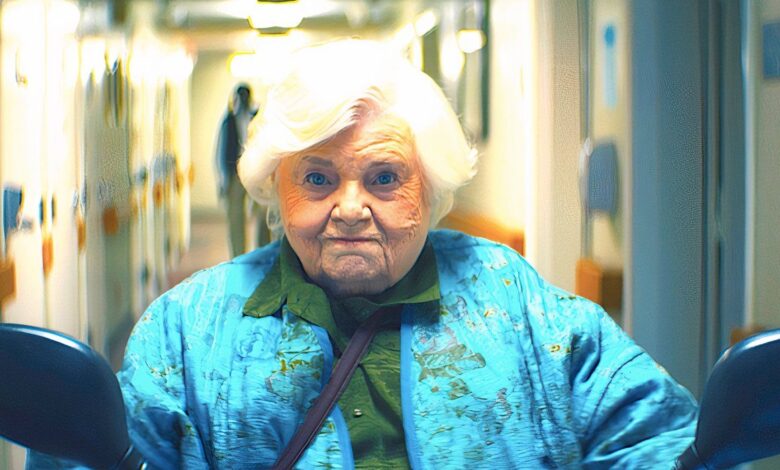 june squibb s thelma rides a mobility scooter down the hallway in thelma 2024
