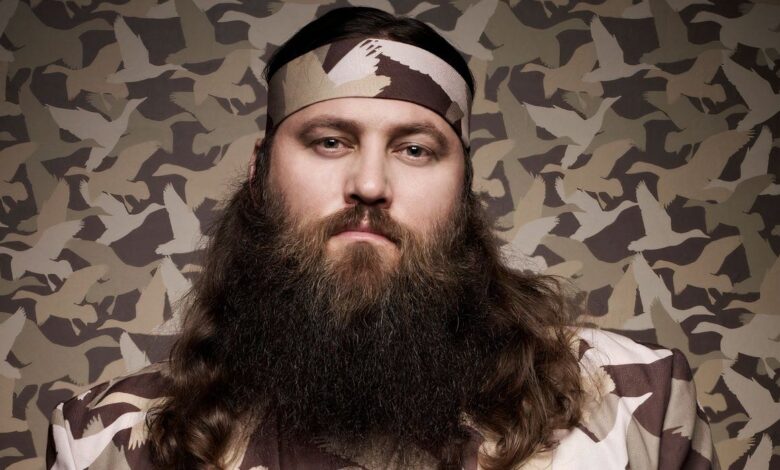 willie robertson frowing in front of camo background