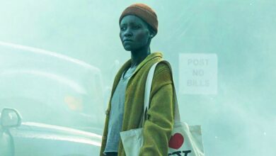 lupita nyong o as sam walking on a deserted street in a quiet place day one